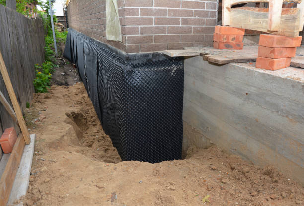 SJ Waterproofing Pros technician performing targeted Interior Drainage System assessment in Riverview, SC